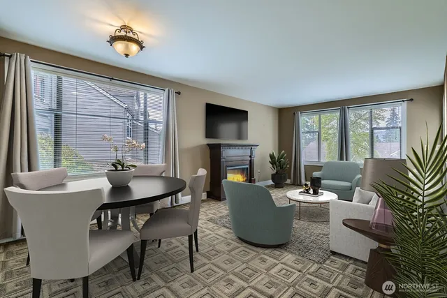 a view of a livingroom with a fireplace and a window