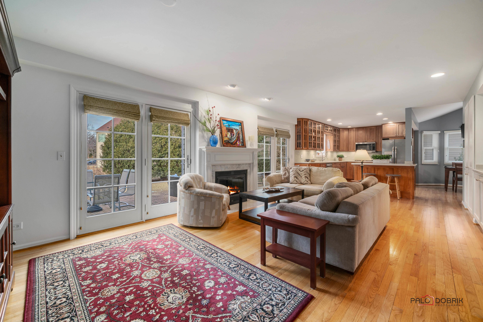 609 Raintree Road Buffalo Grove, IL 60089 - Photo 11 of 48 a living room with furniture large window and a table