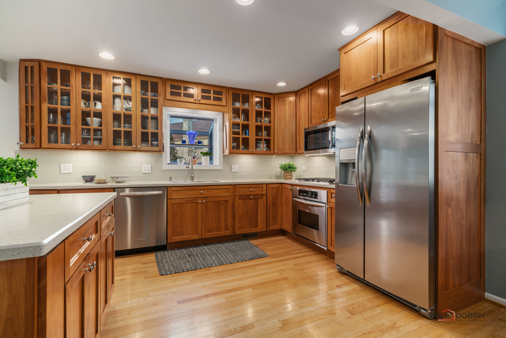 609 Raintree Road Buffalo Grove, IL 60089 - Photo 15 of 48 a kitchen with a sink stainless steel appliances and cabinets