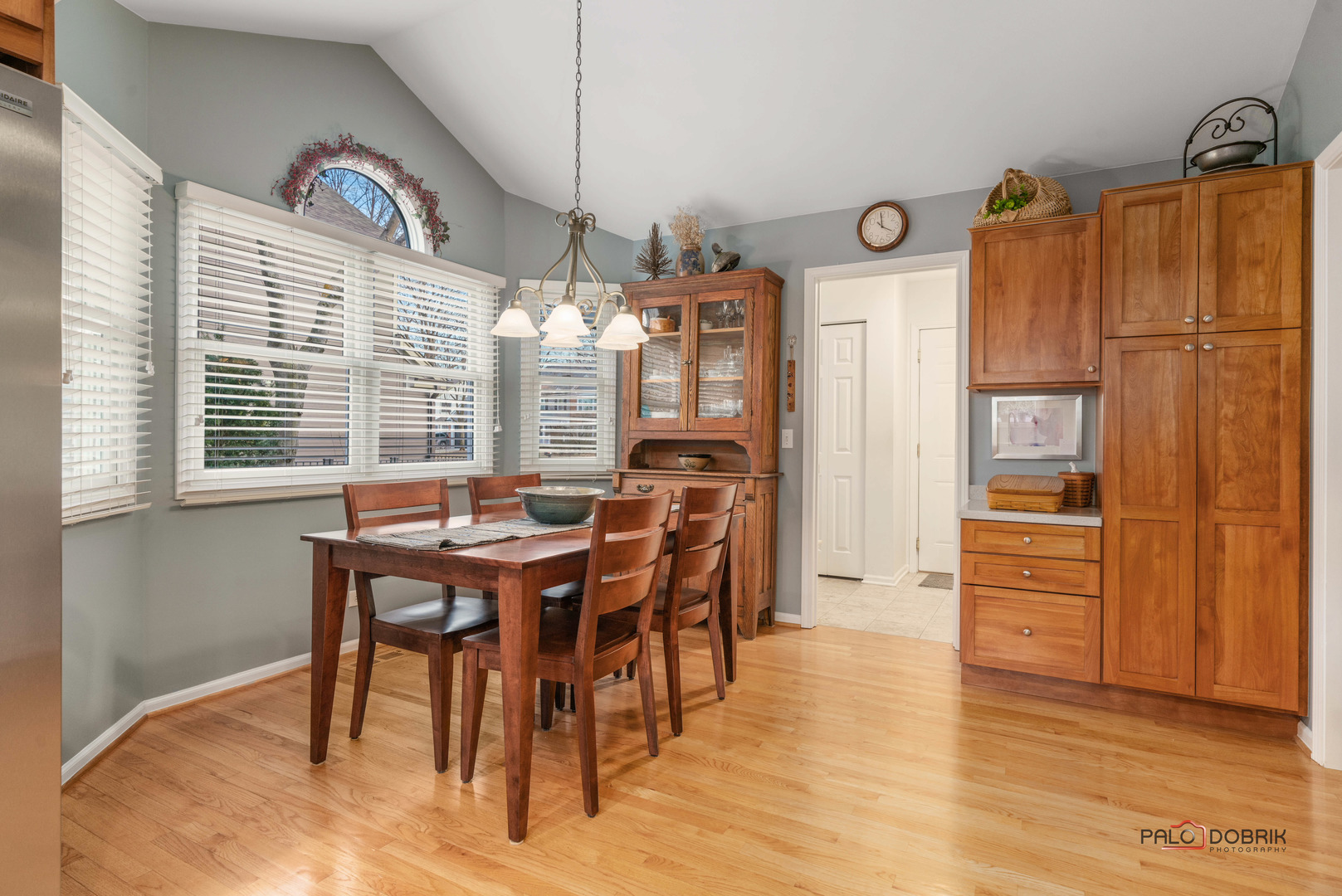 609 Raintree Road Buffalo Grove, IL 60089 - Photo 17 of 48 a view of a dining room with furniture window and wooden floor