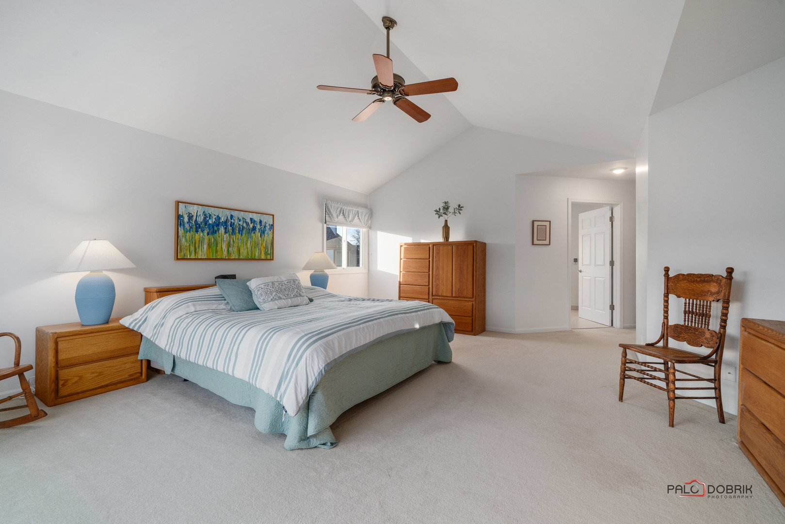609 Raintree Road Buffalo Grove, IL 60089 - Photo 23 of 48 a bedroom with a bed and a chair