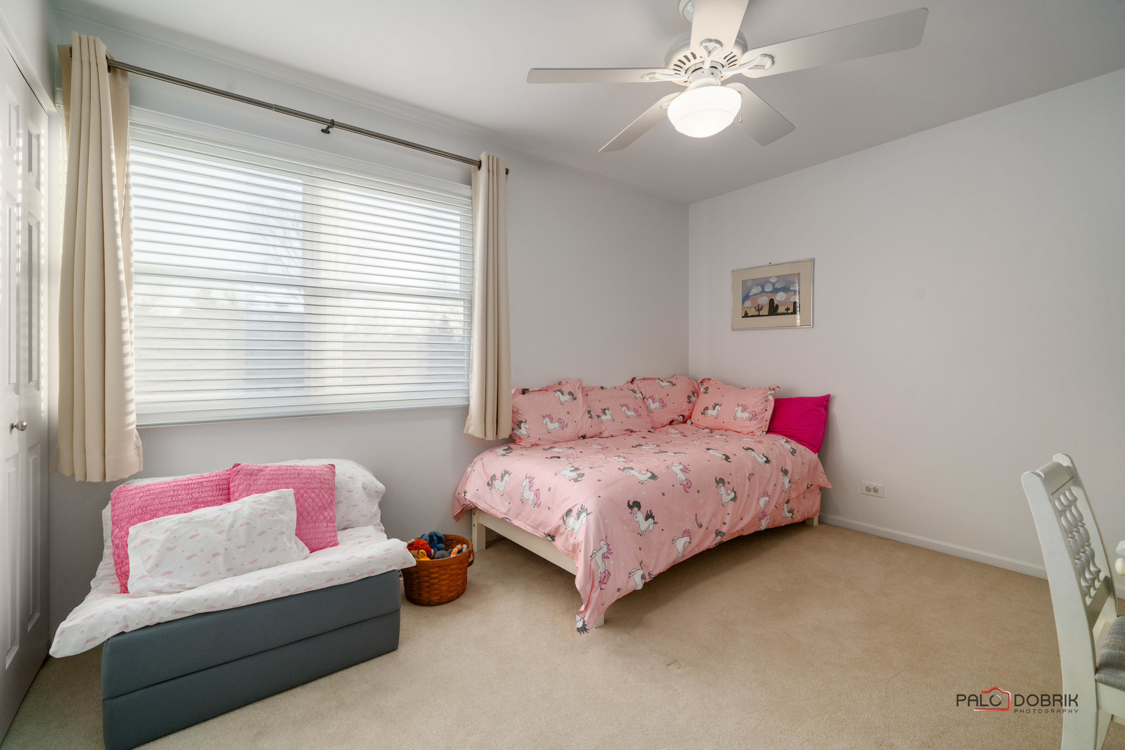 609 Raintree Road Buffalo Grove, IL 60089 - Photo 30 of 48 a bedroom with a bed chandelier and a window