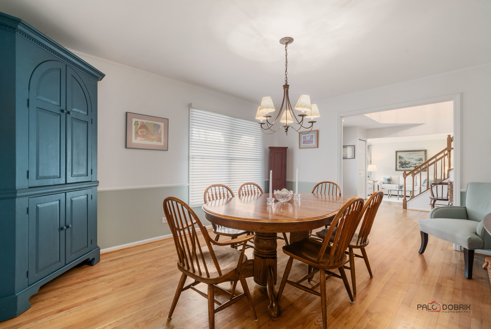 609 Raintree Road Buffalo Grove, IL 60089 - Photo 8 of 48 a view of a dining room and livingroom with furniture wooden floor a chandelier