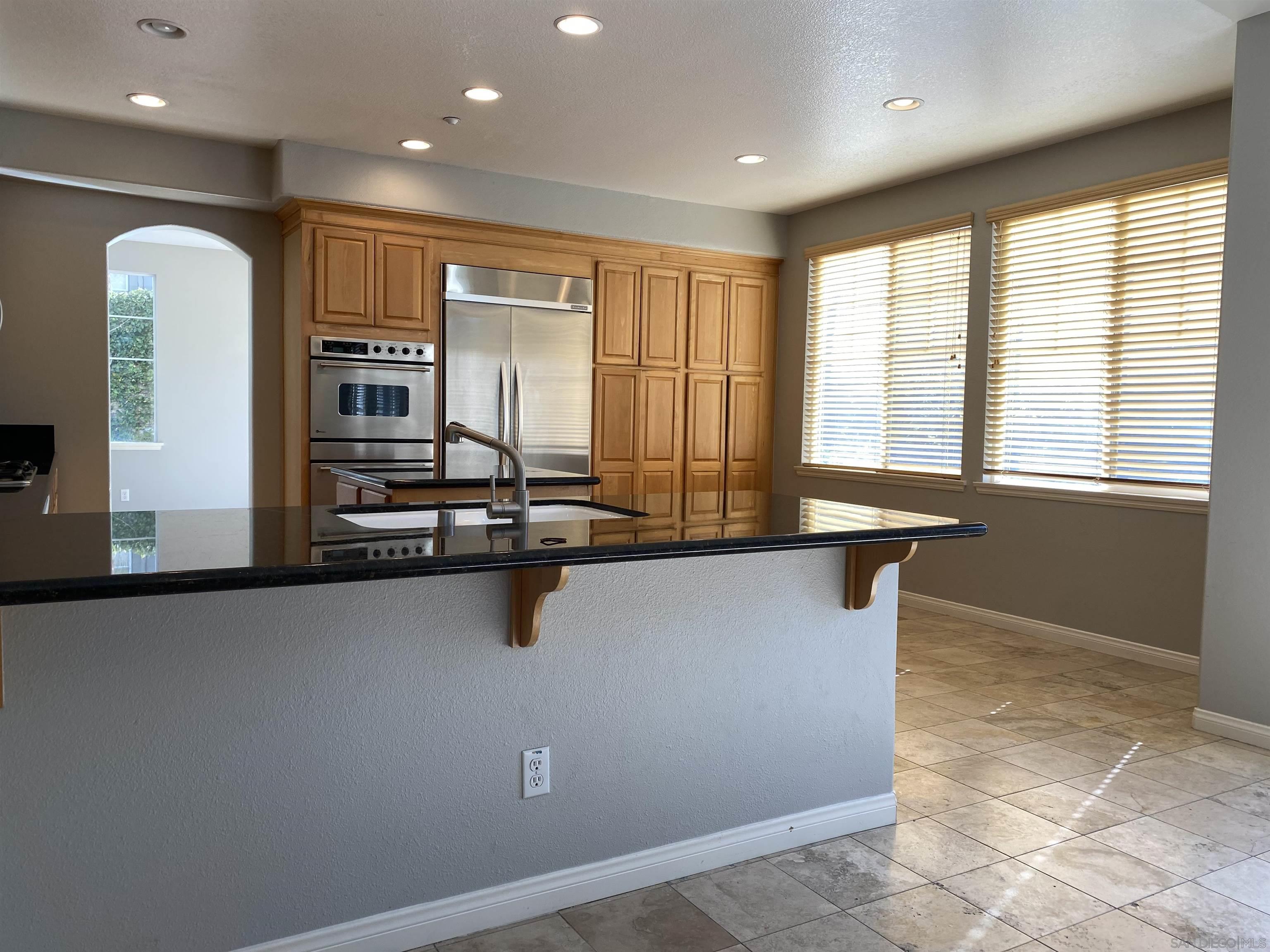 513 Park Lane Encinitas, CA 92024 - Photo 13 of 41 a view of a kitchen with granite countertop a sink and a stove