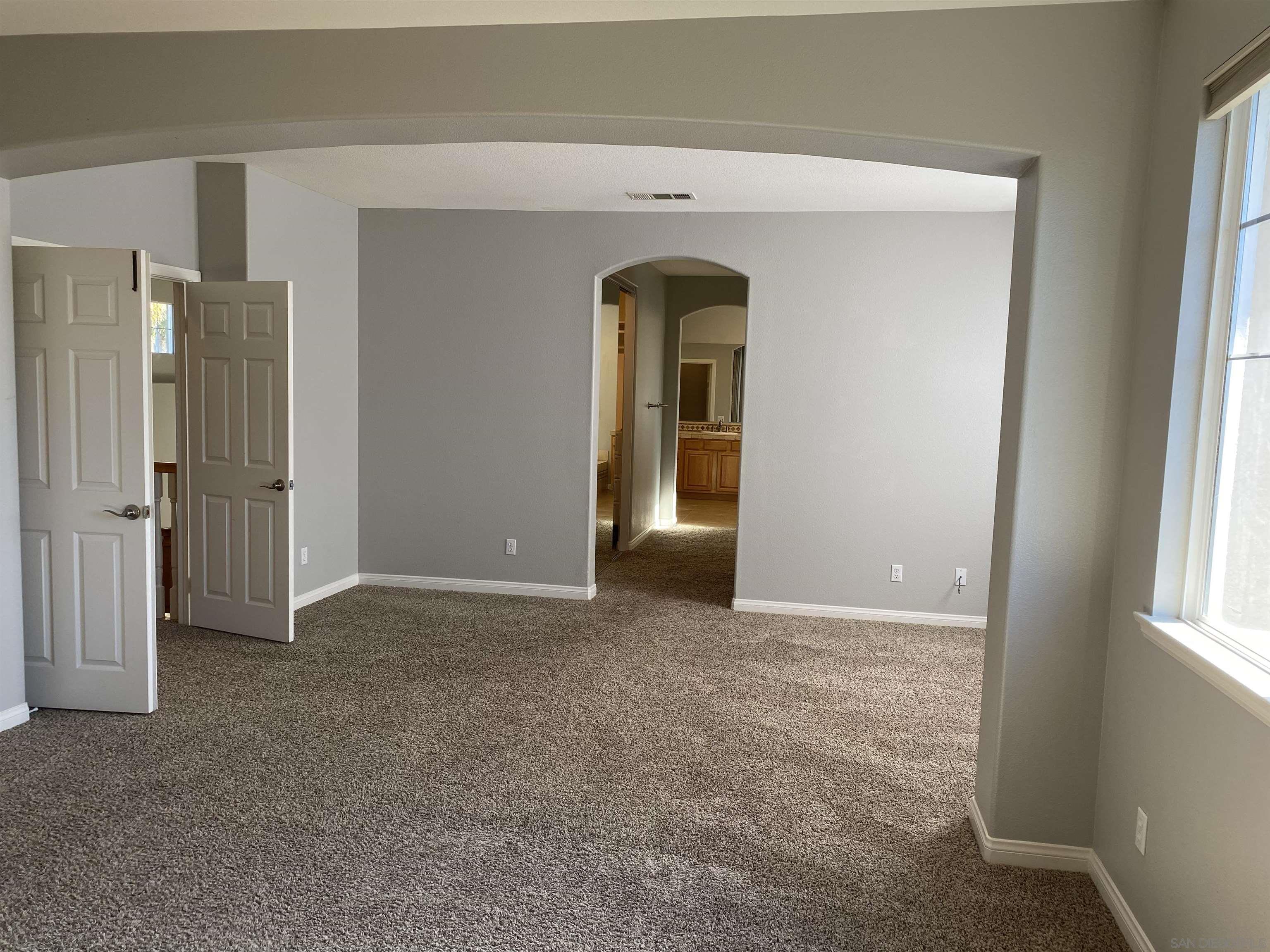 513 Park Lane Encinitas, CA 92024 - Photo 16 of 41 an empty room with windows