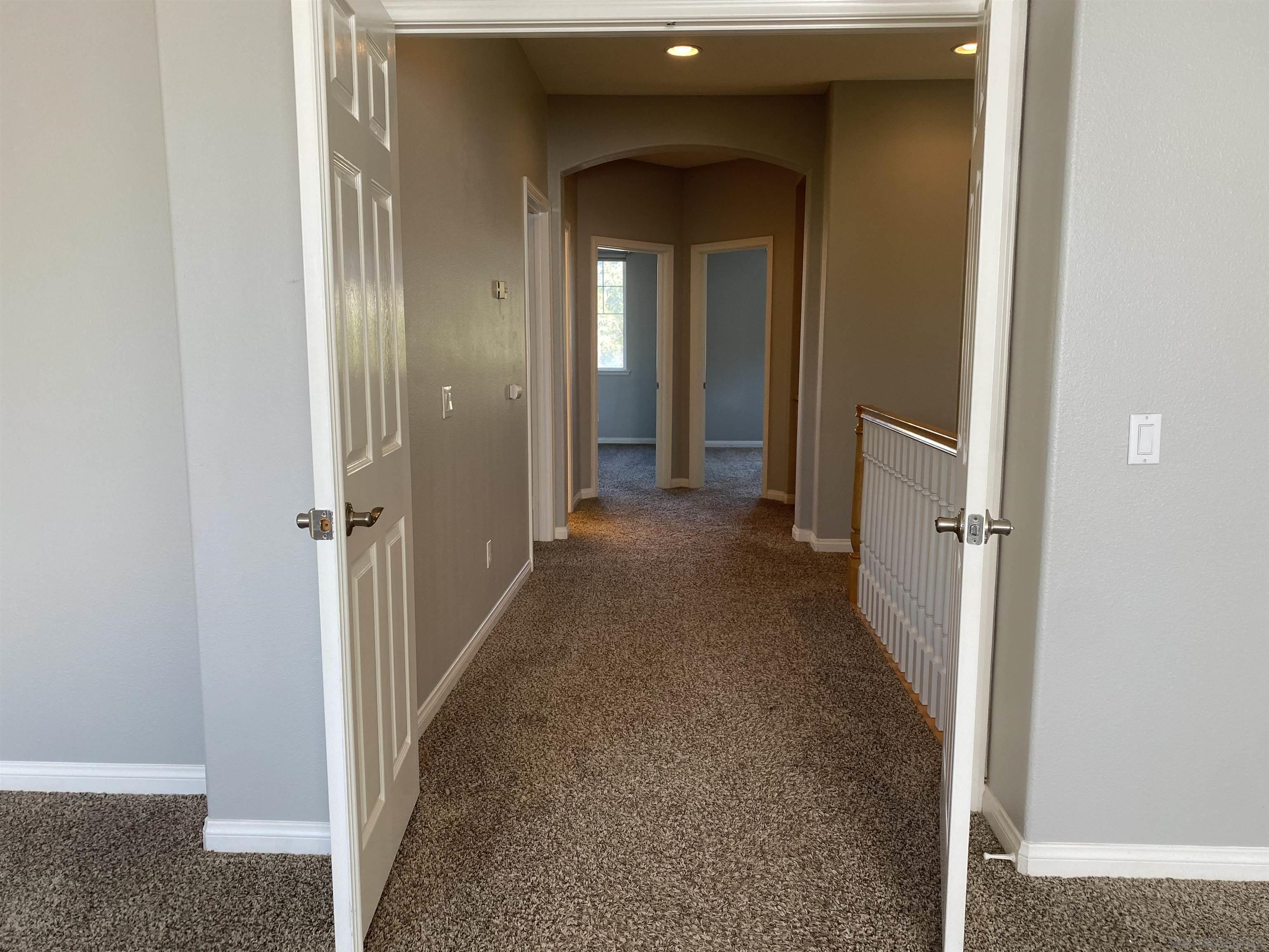 513 Park Lane Encinitas, CA 92024 - Photo 24 of 41 a view of a hallway with wooden floor