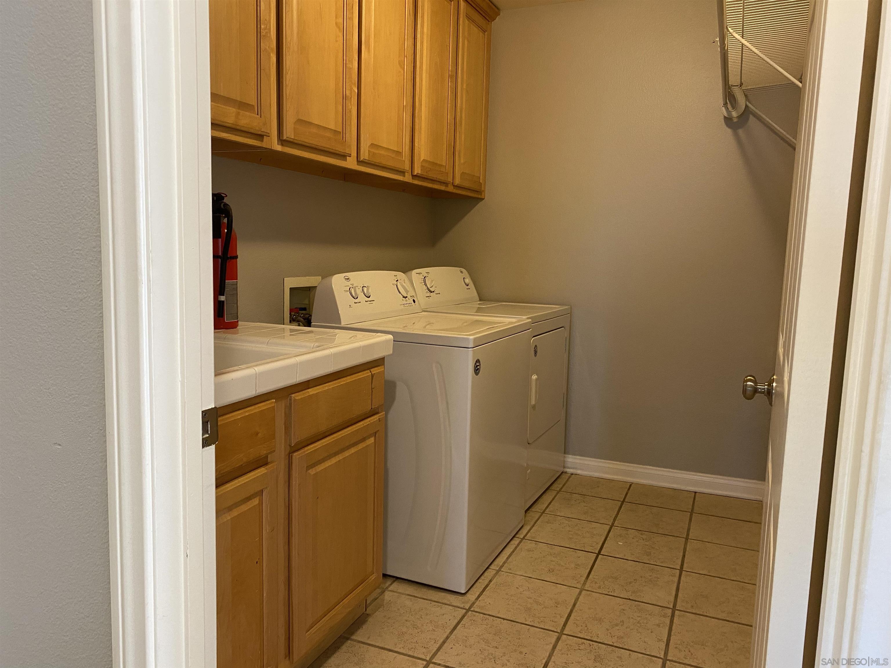 513 Park Lane Encinitas, CA 92024 - Photo 27 of 41 a utility room with dryer and washer