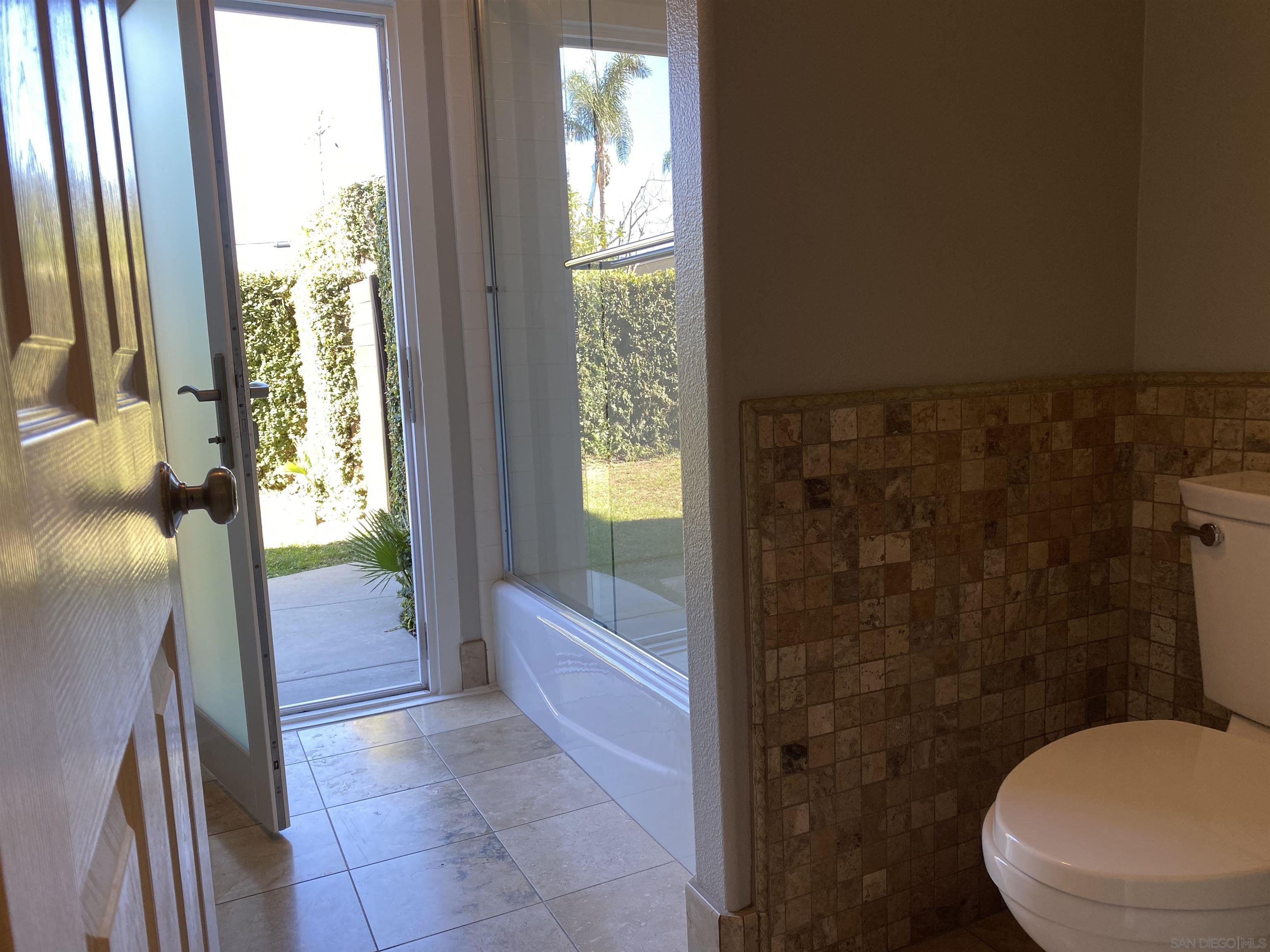 513 Park Lane Encinitas, CA 92024 - Photo 28 of 41 a bathroom with a toilet and a shower