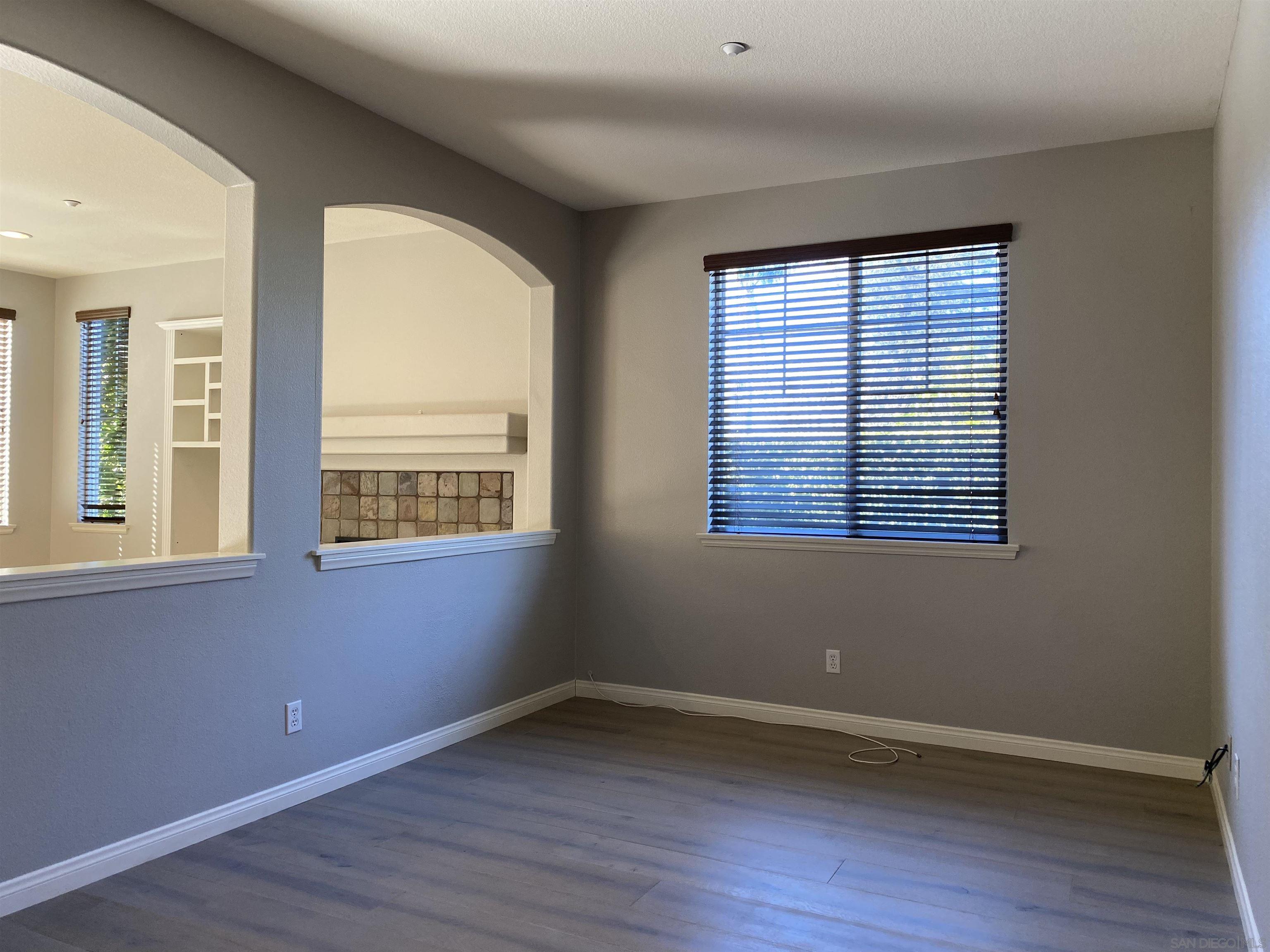 513 Park Lane Encinitas, CA 92024 - Photo 31 of 41 a view of an empty room with wooden floor and a window