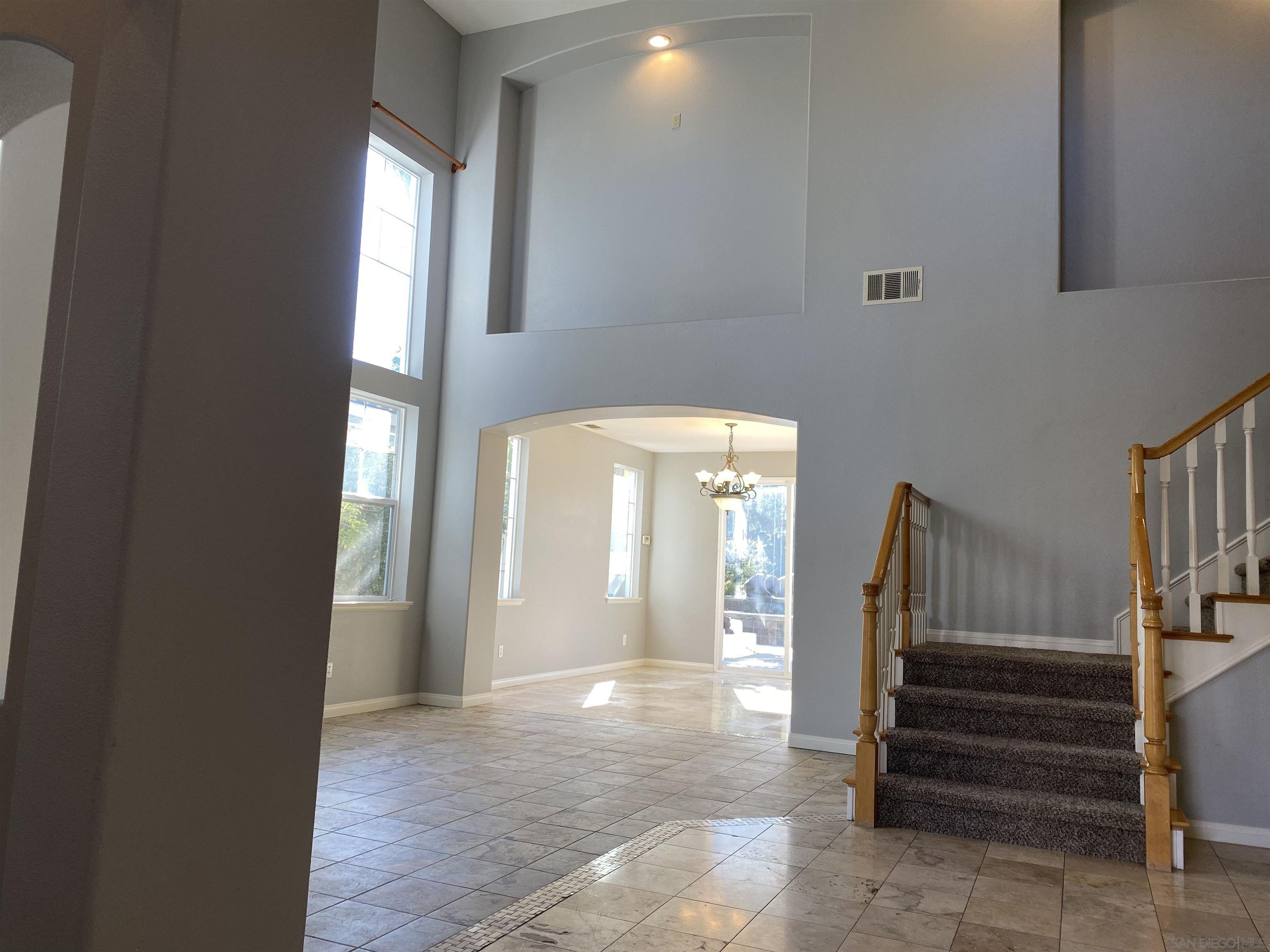 513 Park Lane Encinitas, CA 92024 - Photo 34 of 41 a view of a hallway with entryway and stairs