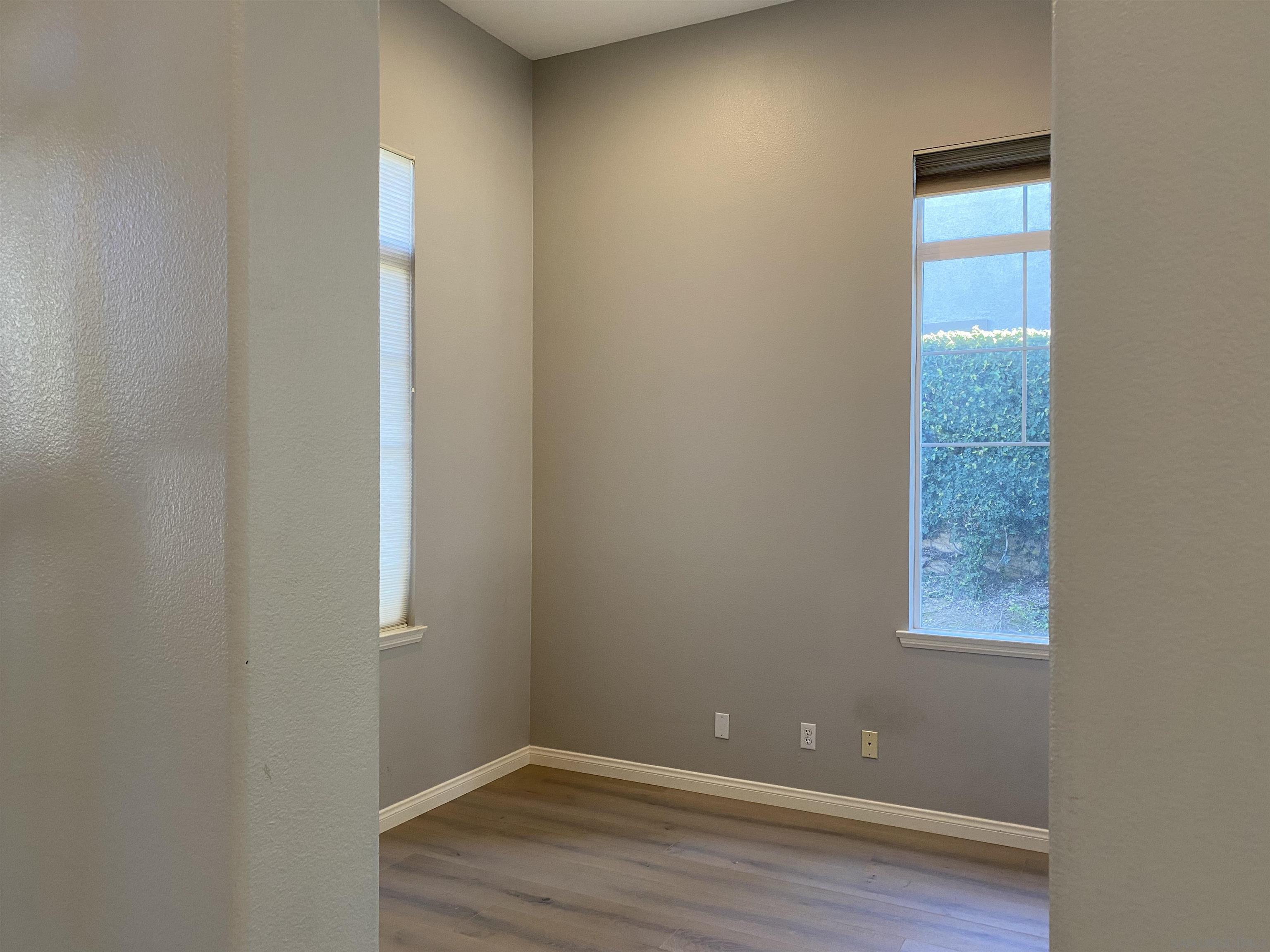 513 Park Lane Encinitas, CA 92024 - Photo 35 of 41 a view of an empty room with wooden floor and a window