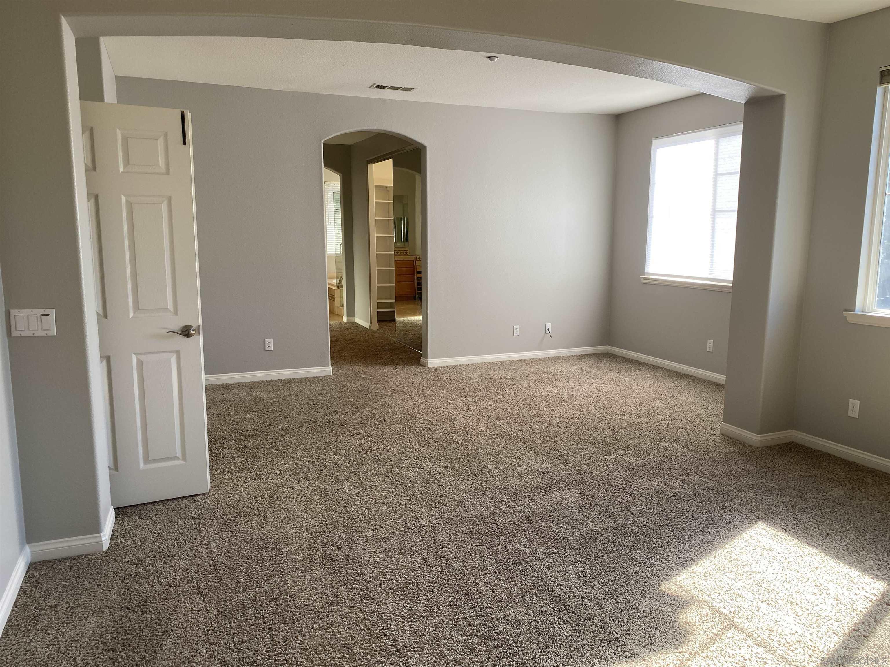 513 Park Lane Encinitas, CA 92024 - Photo 36 of 41 an empty room with windows and closet
