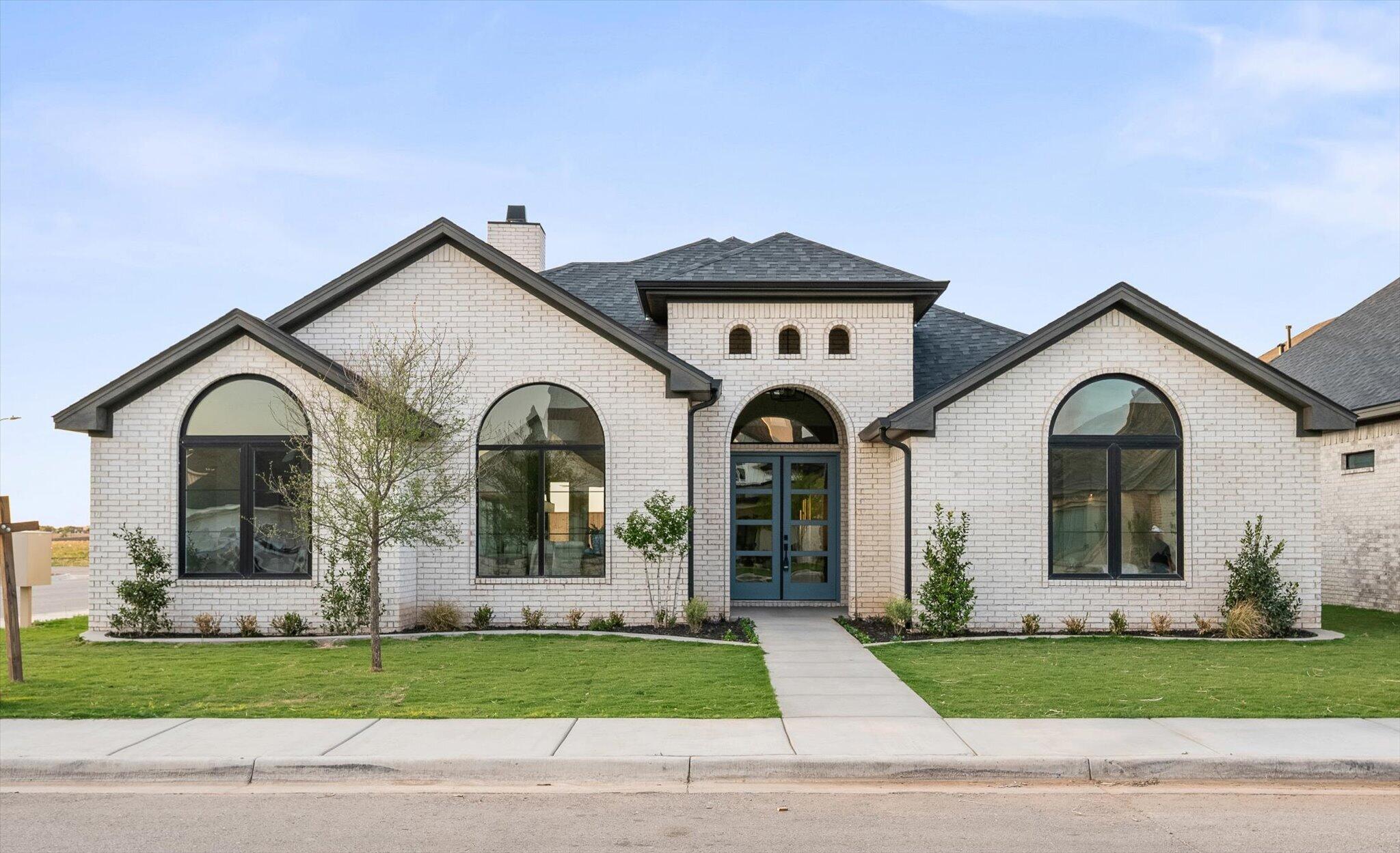 4622 138th Place Lubbock, TX 79424 - Photo 2 of 48 a front view of a house with a yard