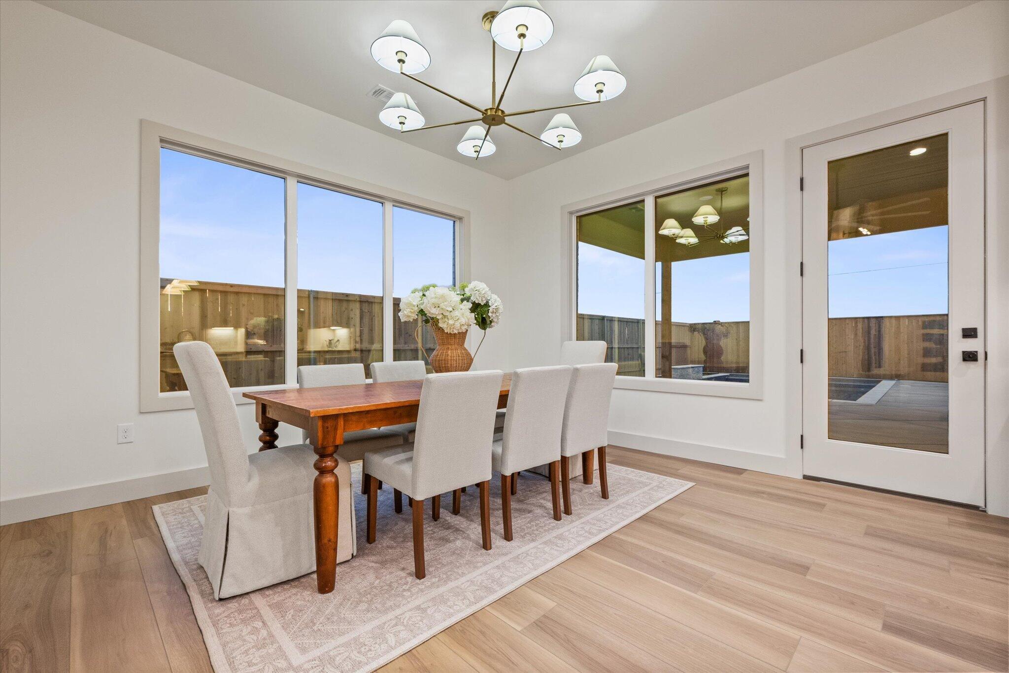 4622 138th Place Lubbock, TX 79424 - Photo 23 of 48 a view of a dining room with furniture window and wooden floor