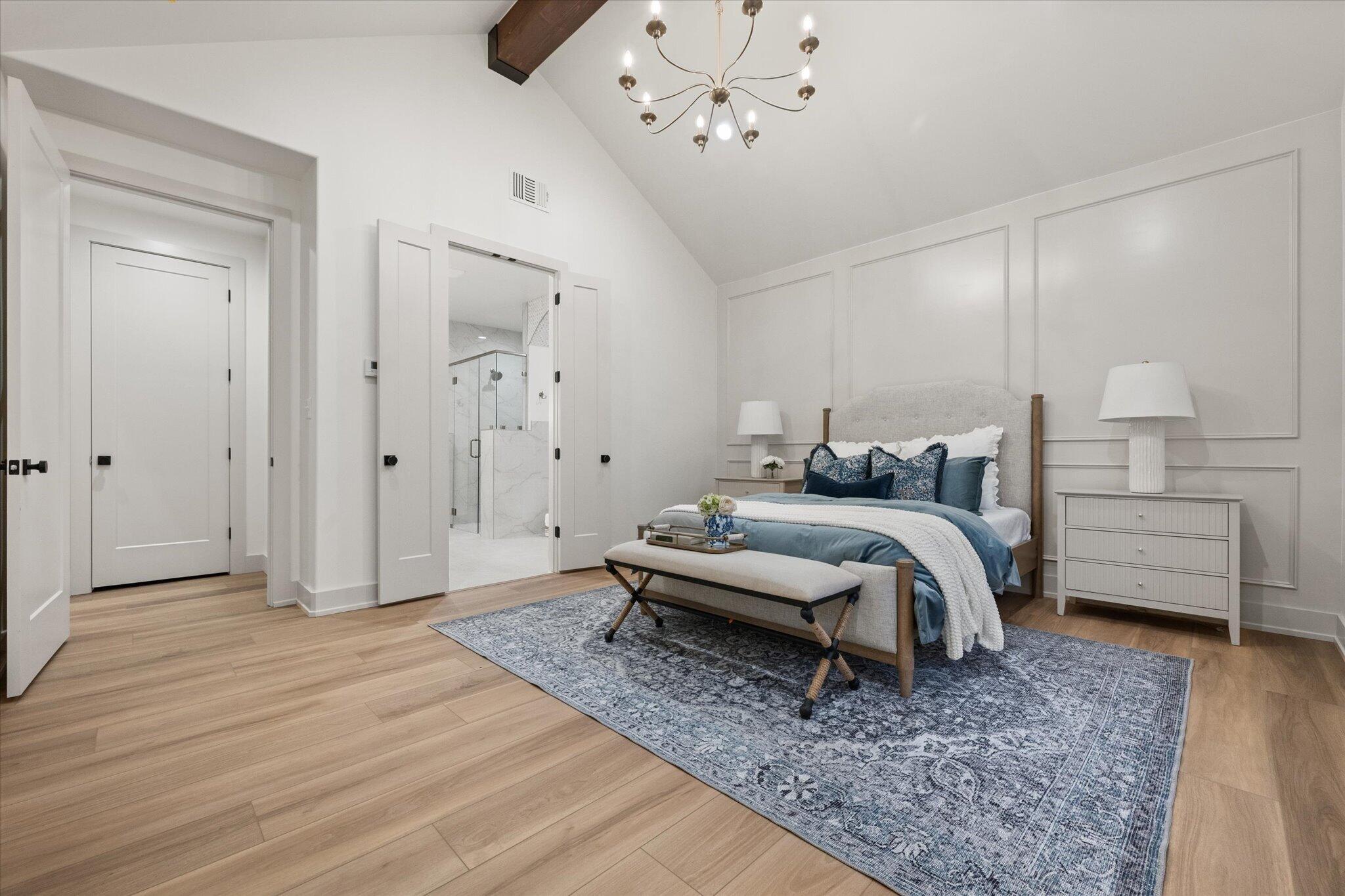 4622 138th Place Lubbock, TX 79424 - Photo 29 of 48 a bedroom with a bed and a chandelier