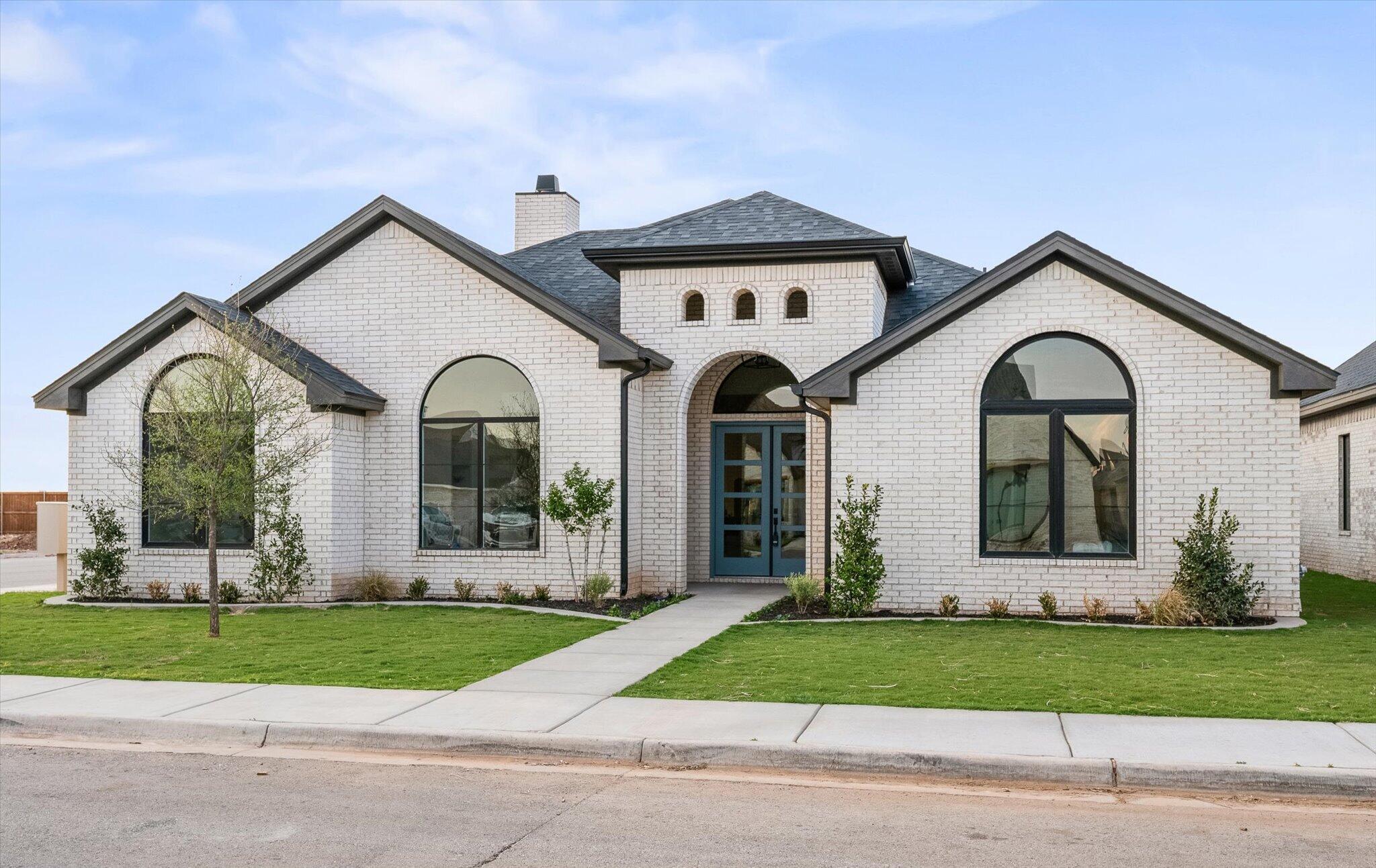 4622 138th Place Lubbock, TX 79424 - Photo 3 of 48 a front view of a house with garden