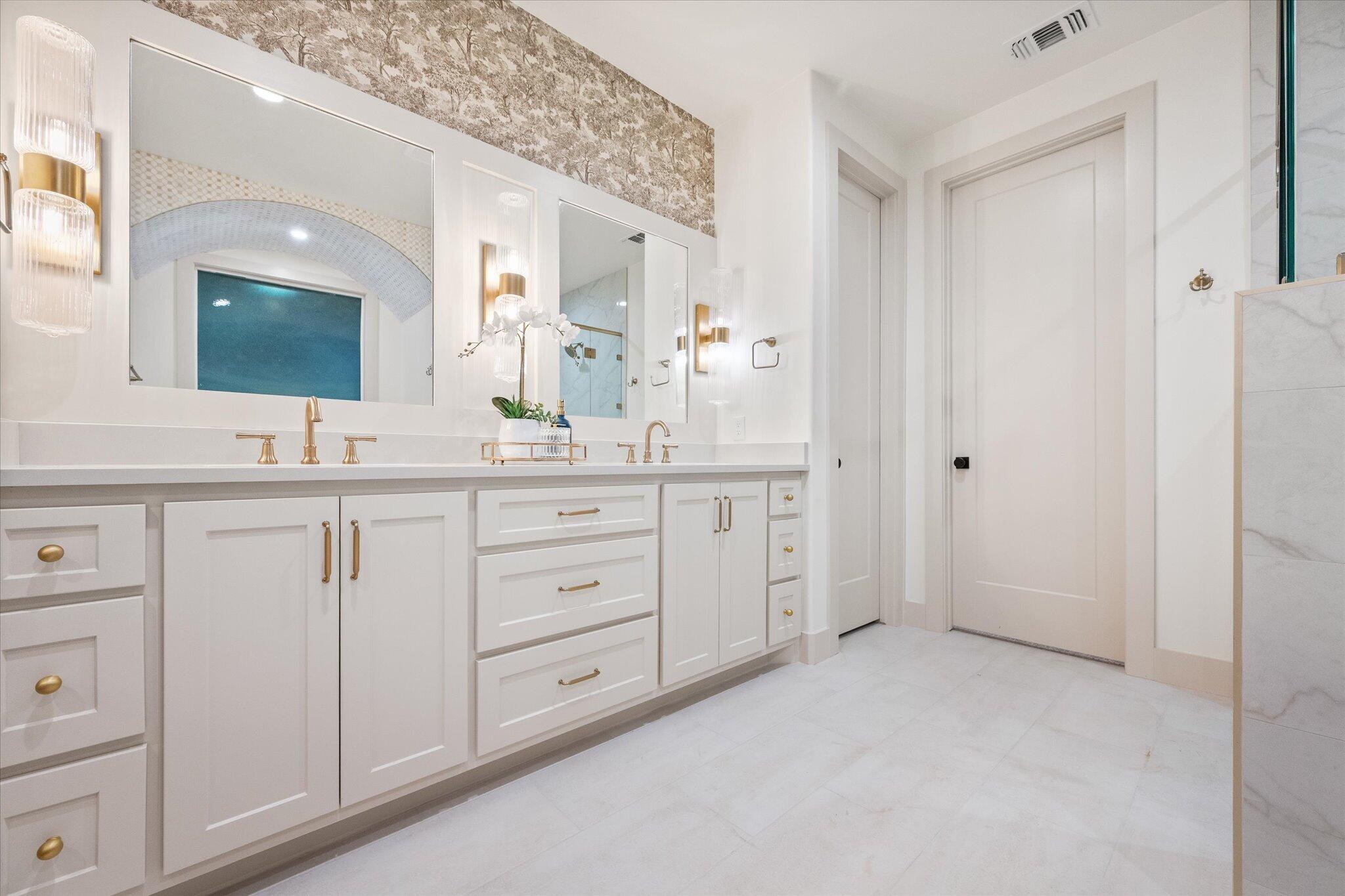 4622 138th Place Lubbock, TX 79424 - Photo 31 of 48 a spacious bathroom with a double vanity sink a mirror a and a