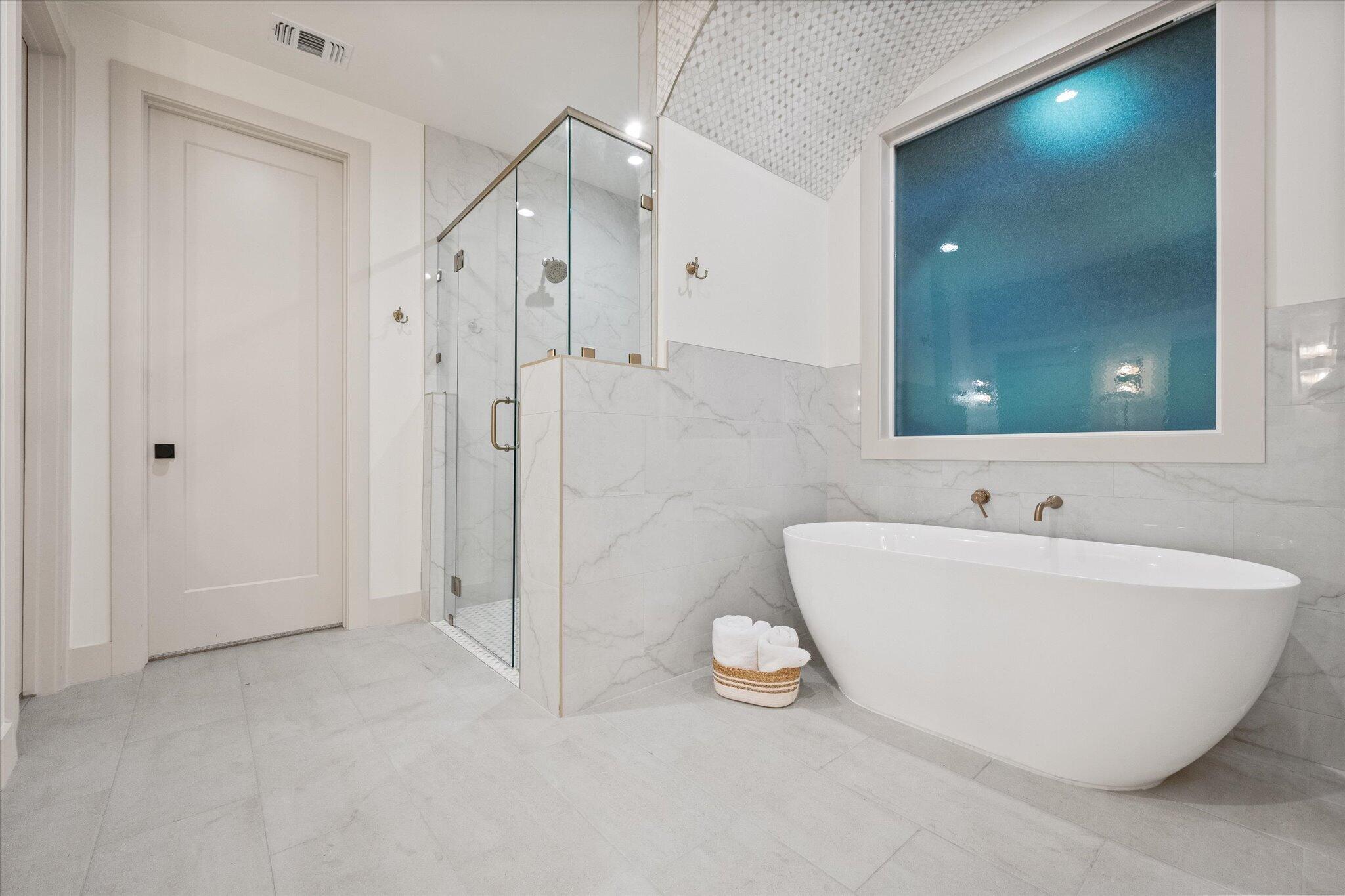 4622 138th Place Lubbock, TX 79424 - Photo 34 of 48 a bathroom with a tub and a shower