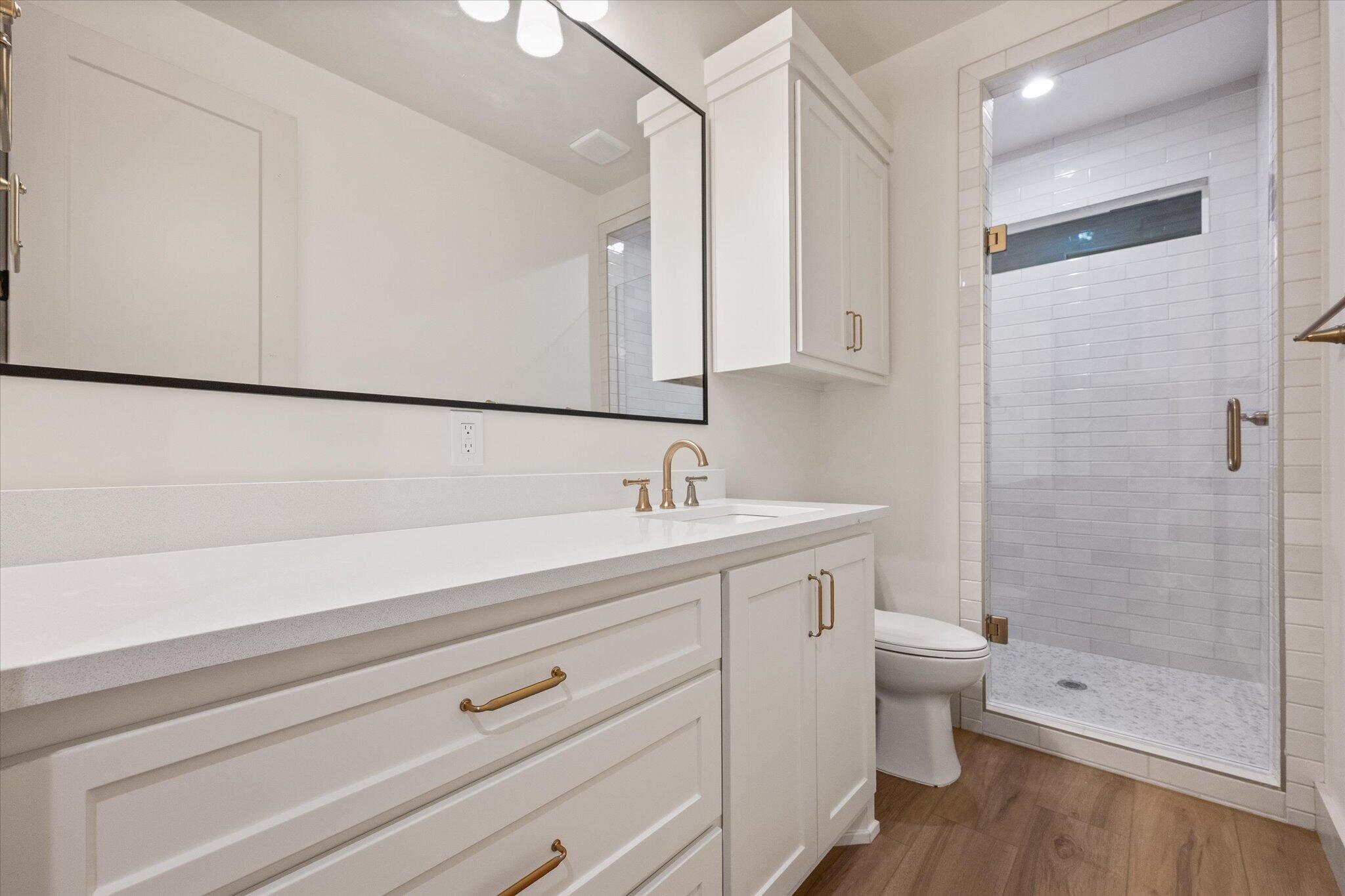 4622 138th Place Lubbock, TX 79424 - Photo 42 of 48 a bathroom with a sink a toilet and shower