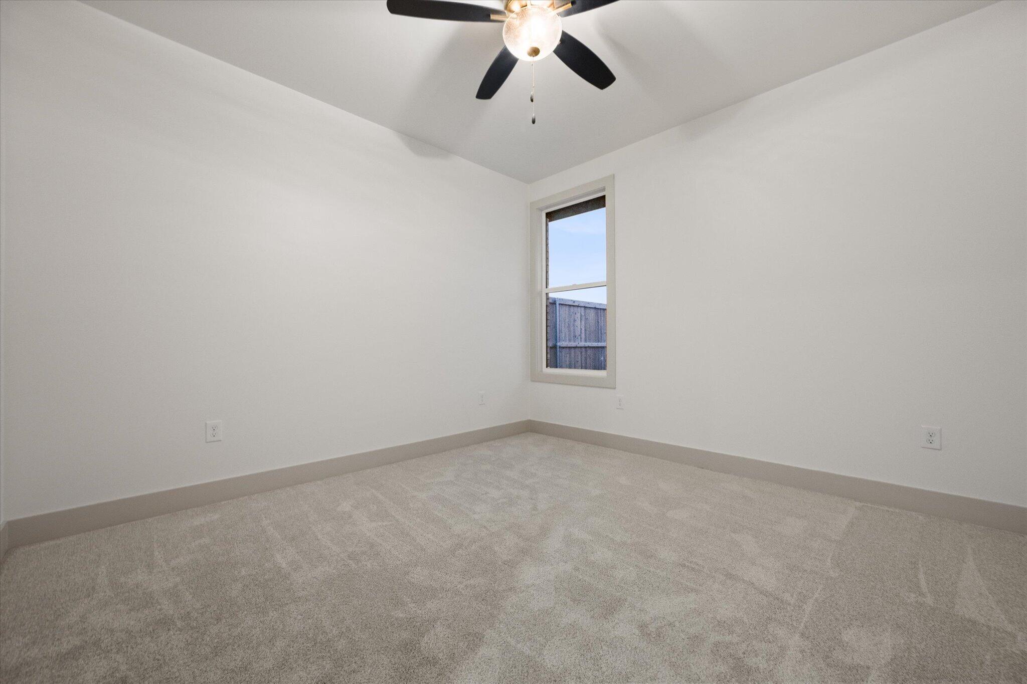4622 138th Place Lubbock, TX 79424 - Photo 43 of 48 an empty room with a window and a fan