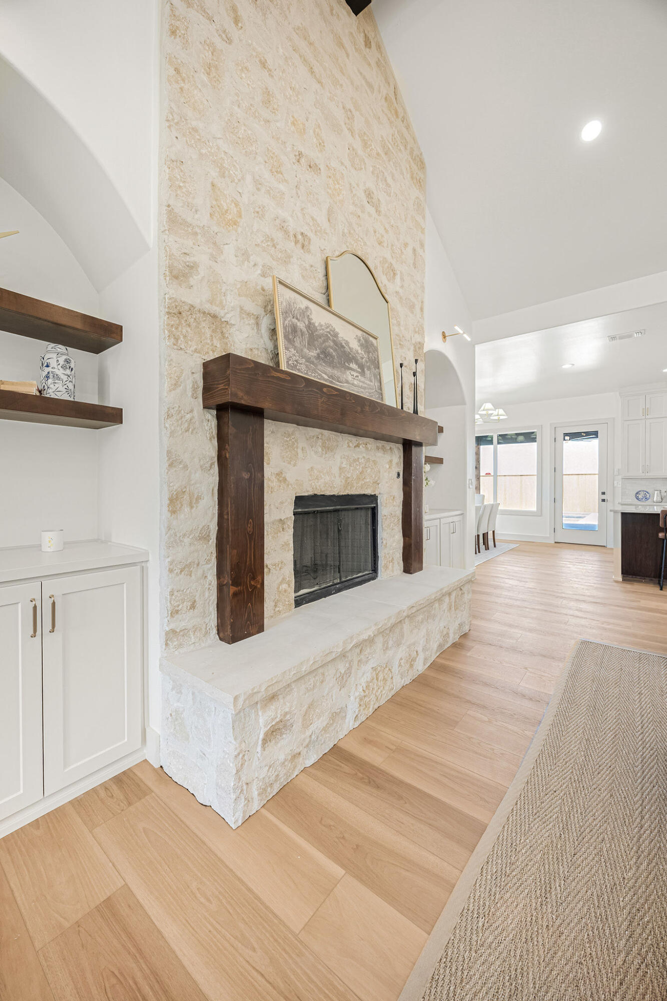4622 138th Place Lubbock, TX 79424 - Photo 7 of 48 a view of a livingroom with wooden floor and a fireplace