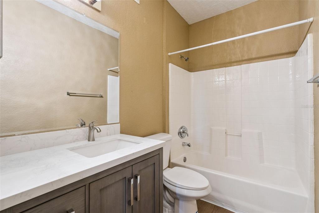 825 Grand Regency Point, Unit 103 Altamonte Springs, FL 32714 - Photo 15 of 20 a bathroom with a sink a toilet and shower