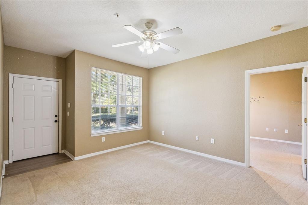 825 Grand Regency Point, Unit 103 Altamonte Springs, FL 32714 - Photo 4 of 20 a view of an empty room with a window
