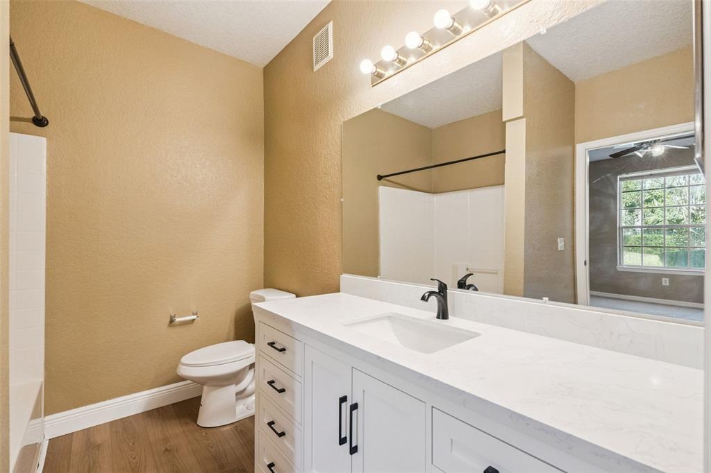 825 Grand Regency Point, Unit 103 Altamonte Springs, FL 32714 - Photo 10 of 20 a bathroom with a sink a toilet and shower