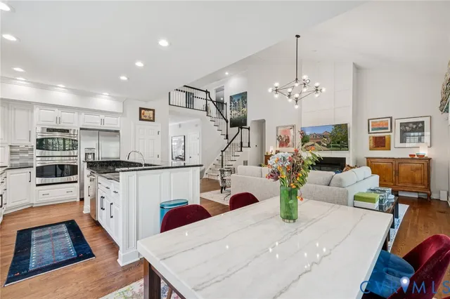 a kitchen view with living room and stove