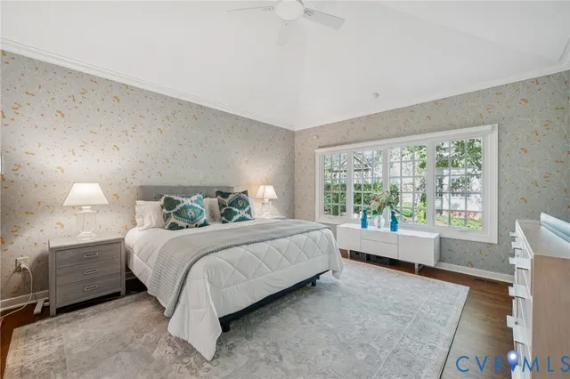 a bed room with a bed and a large window