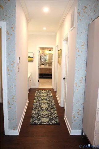 walk in closet with wooden floor