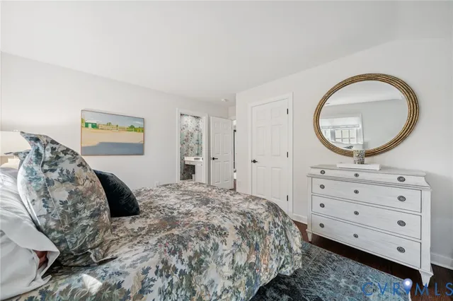 a bedroom with a bed and a dresser