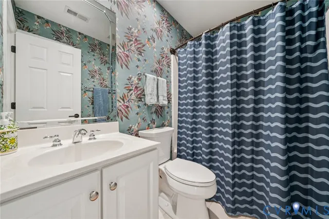 a bathroom with a sink and a toilet
