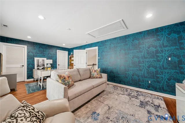 a living room with furniture and a rug