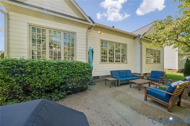 a outdoor living space with furniture and a potted plant