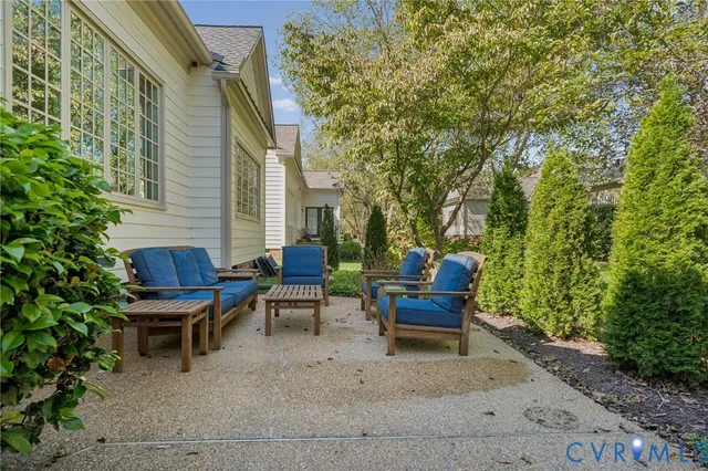 a view of a bench in the backyard