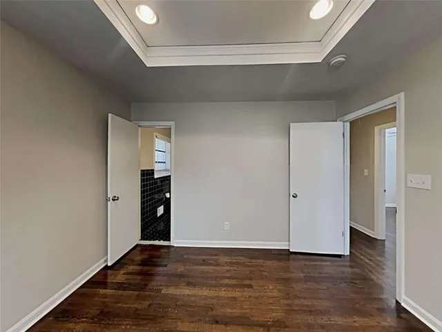 a kitchen with a sink and wooden cabinets