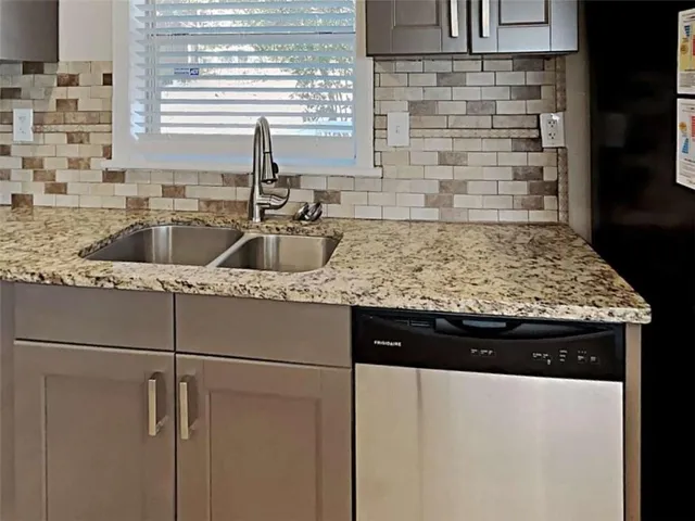 a view of a livingroom with wooden floor