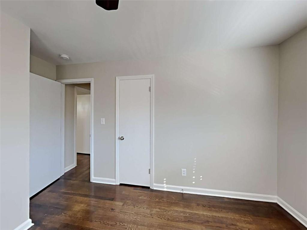 3148 Thrasher Circle Decatur, GA 30032 - Photo 19 of 20 a view of an empty room with wooden floor
