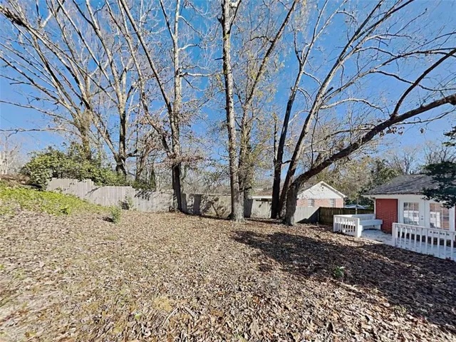 a view of a yard with a tree