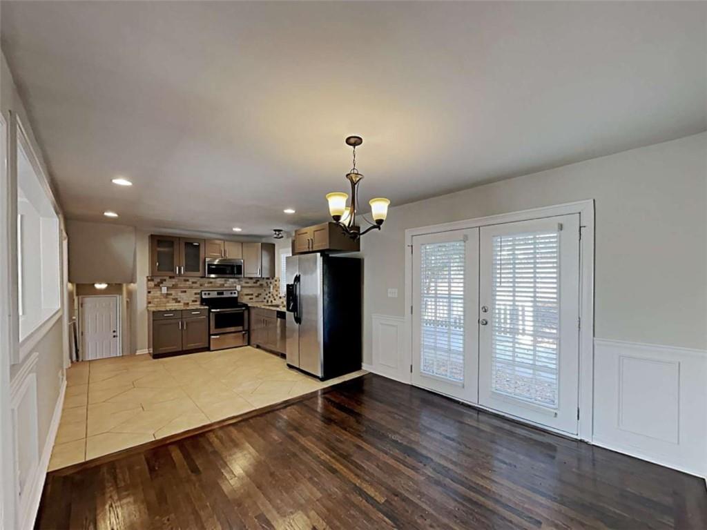 3148 Thrasher Circle Decatur, GA 30032 - Photo 9 of 20 a view of a kitchen with a sink refrigerator and wooden floor