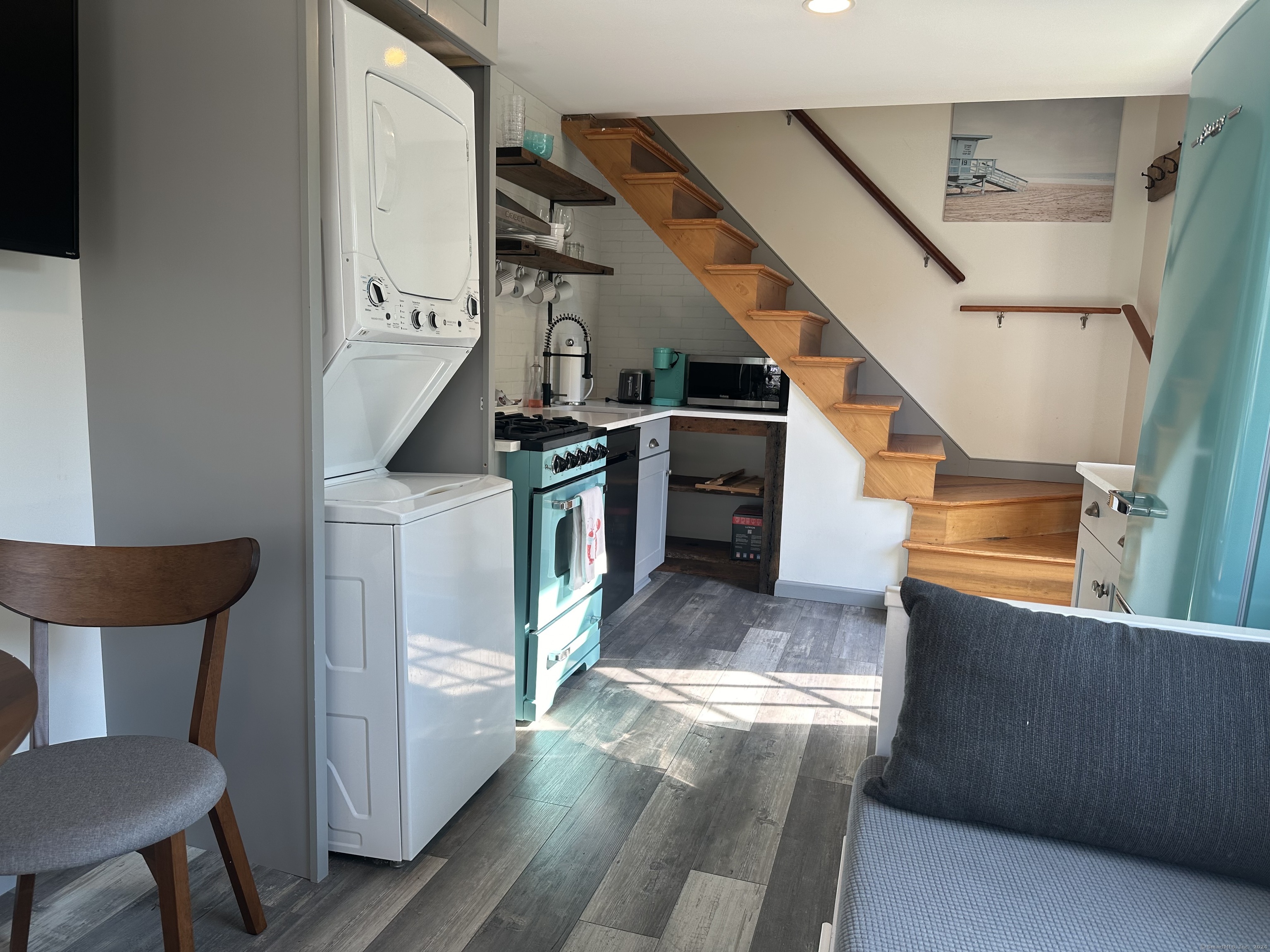53 Liberty Street, Unit A Madison, CT 06443 - Photo 3 of 18 a view of a kitchen with furniture and a kitchen