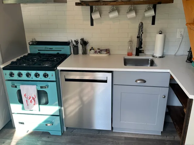 a kitchen with a stove and a refrigerator