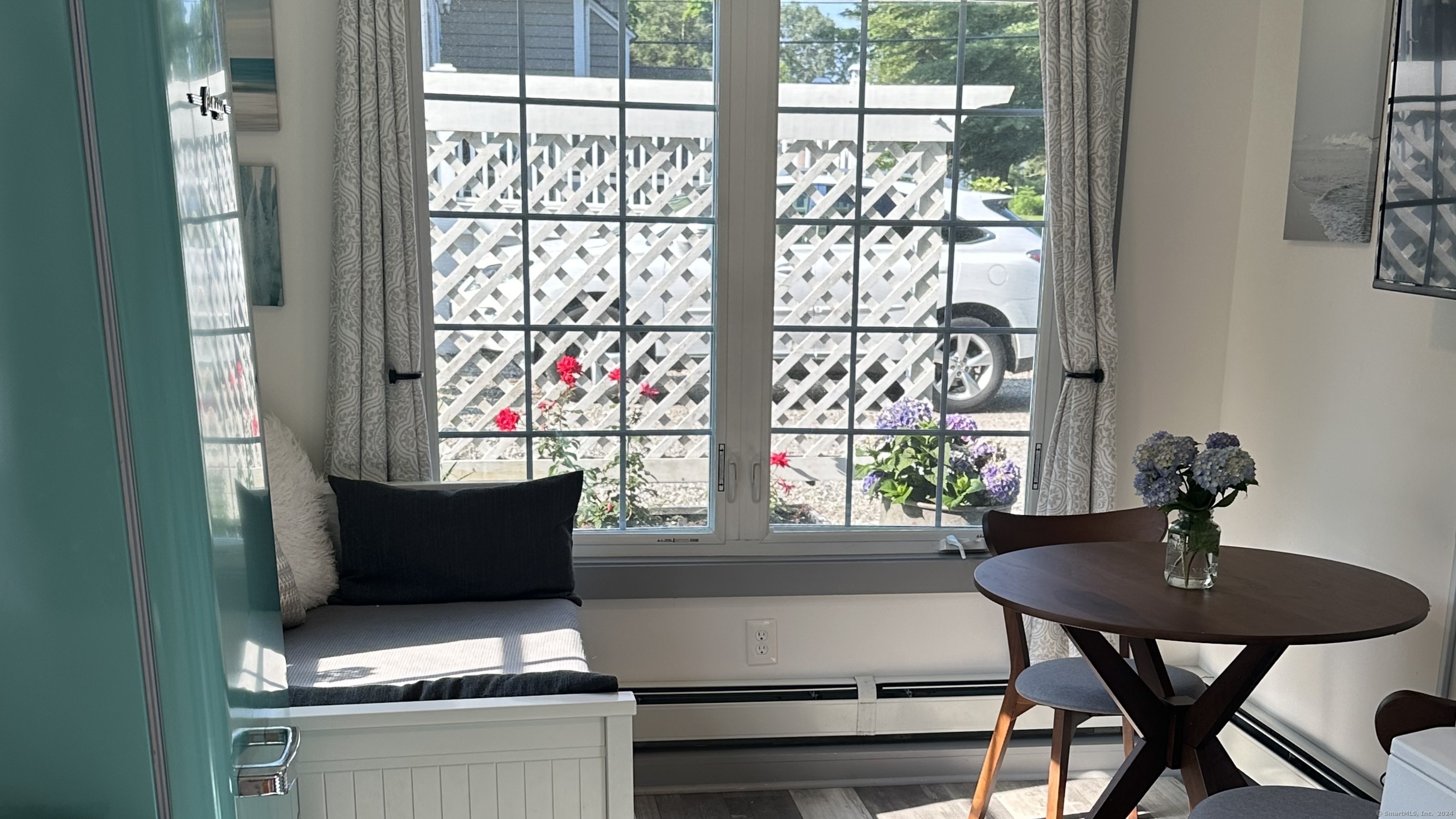 53 Liberty Street, Unit A Madison, CT 06443 - Photo 5 of 18 a view of a dining room with furniture and window
