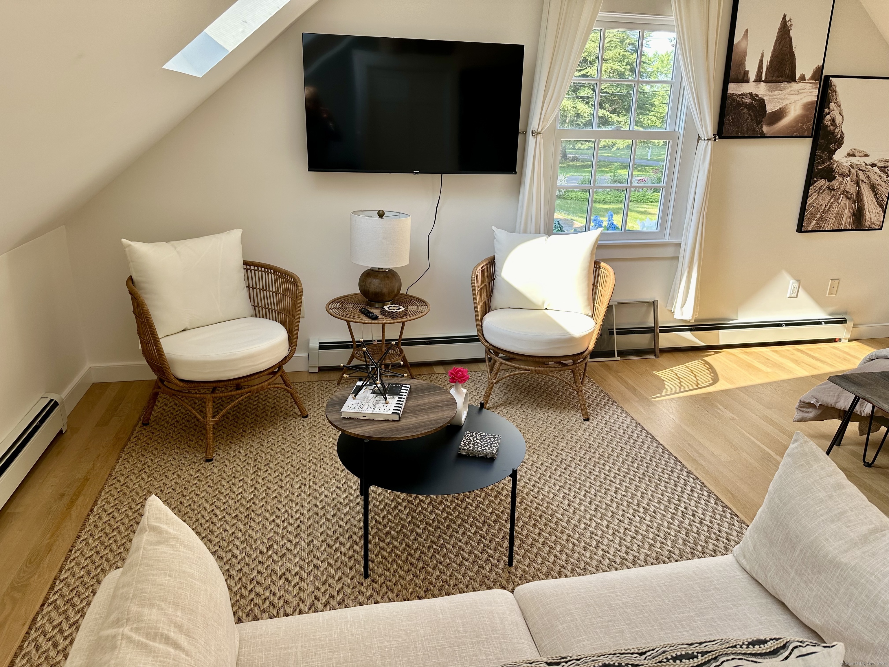 53 Liberty Street, Unit A Madison, CT 06443 - Photo 8 of 18 a living room with furniture and a flat screen tv