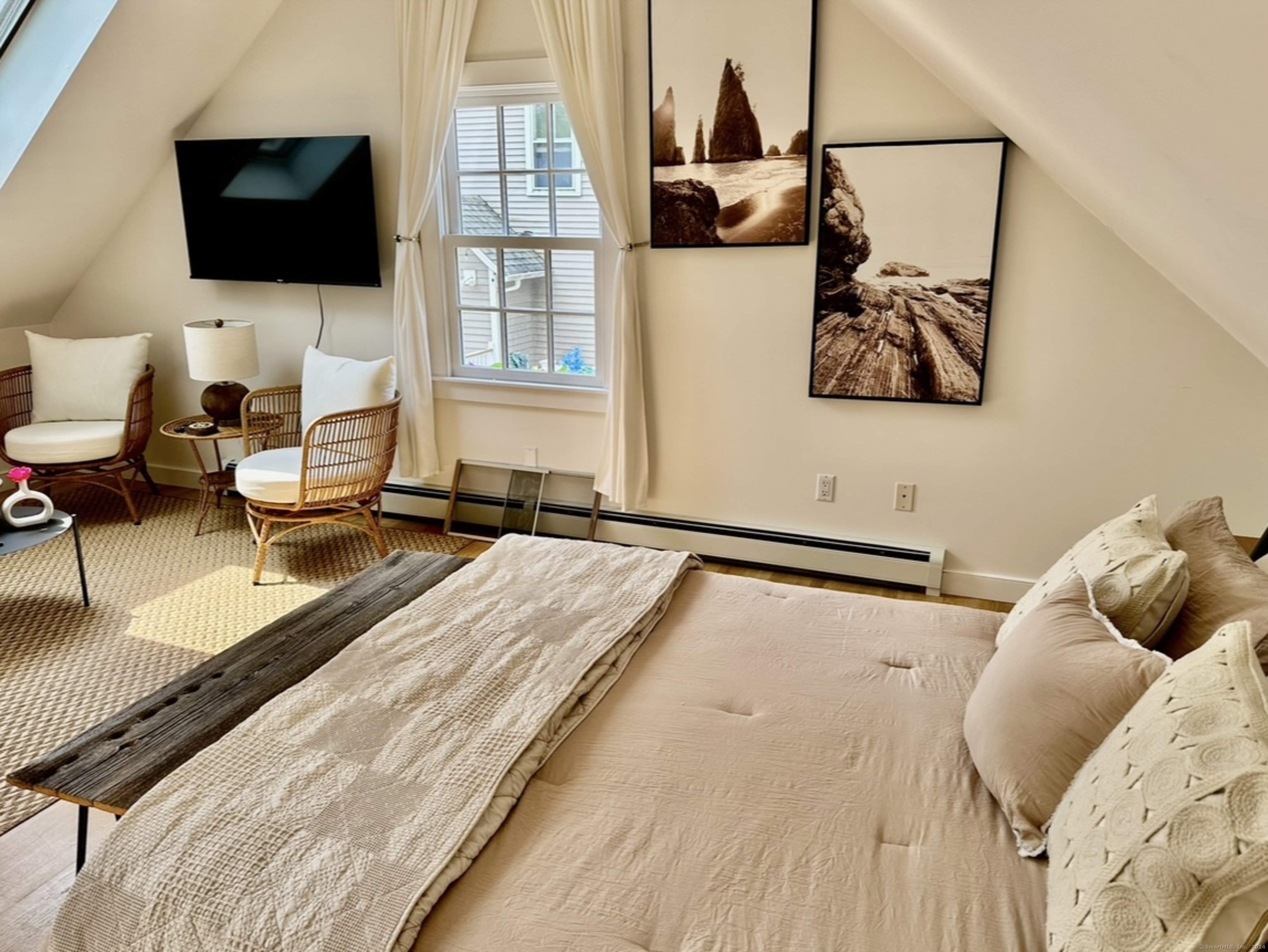 53 Liberty Street, Unit A Madison, CT 06443 - Photo 9 of 18 a living room with furniture and a flat screen tv