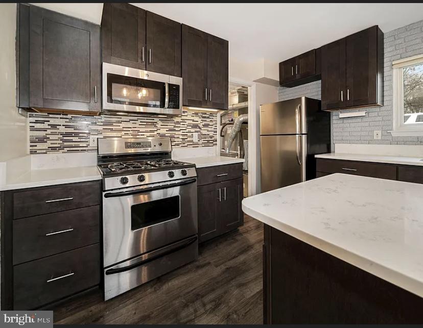 9481 Farewell Road Columbia, MD 21045 - Photo 12 of 18 a kitchen with a refrigerator stove and microwave