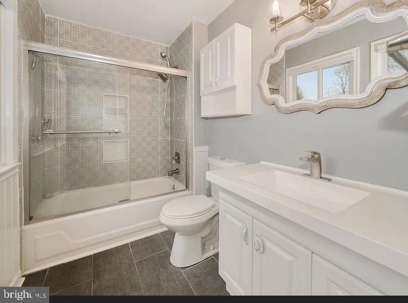 9481 Farewell Road Columbia, MD 21045 - Photo 13 of 18 a bathroom with a sink toilet and shower