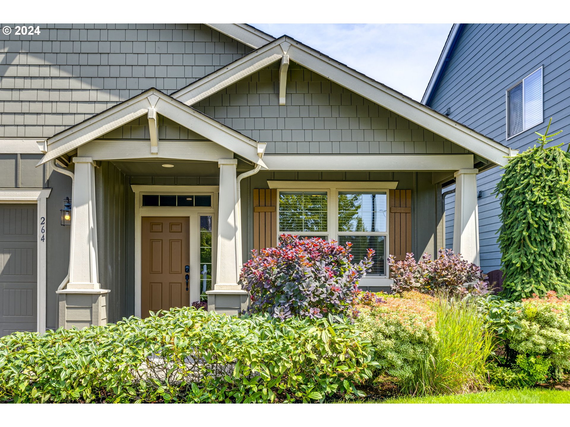 264 North Green Gables Loop Ridgefield, WA 98642 - Photo 2 of 46 a view of a house with potted plants
