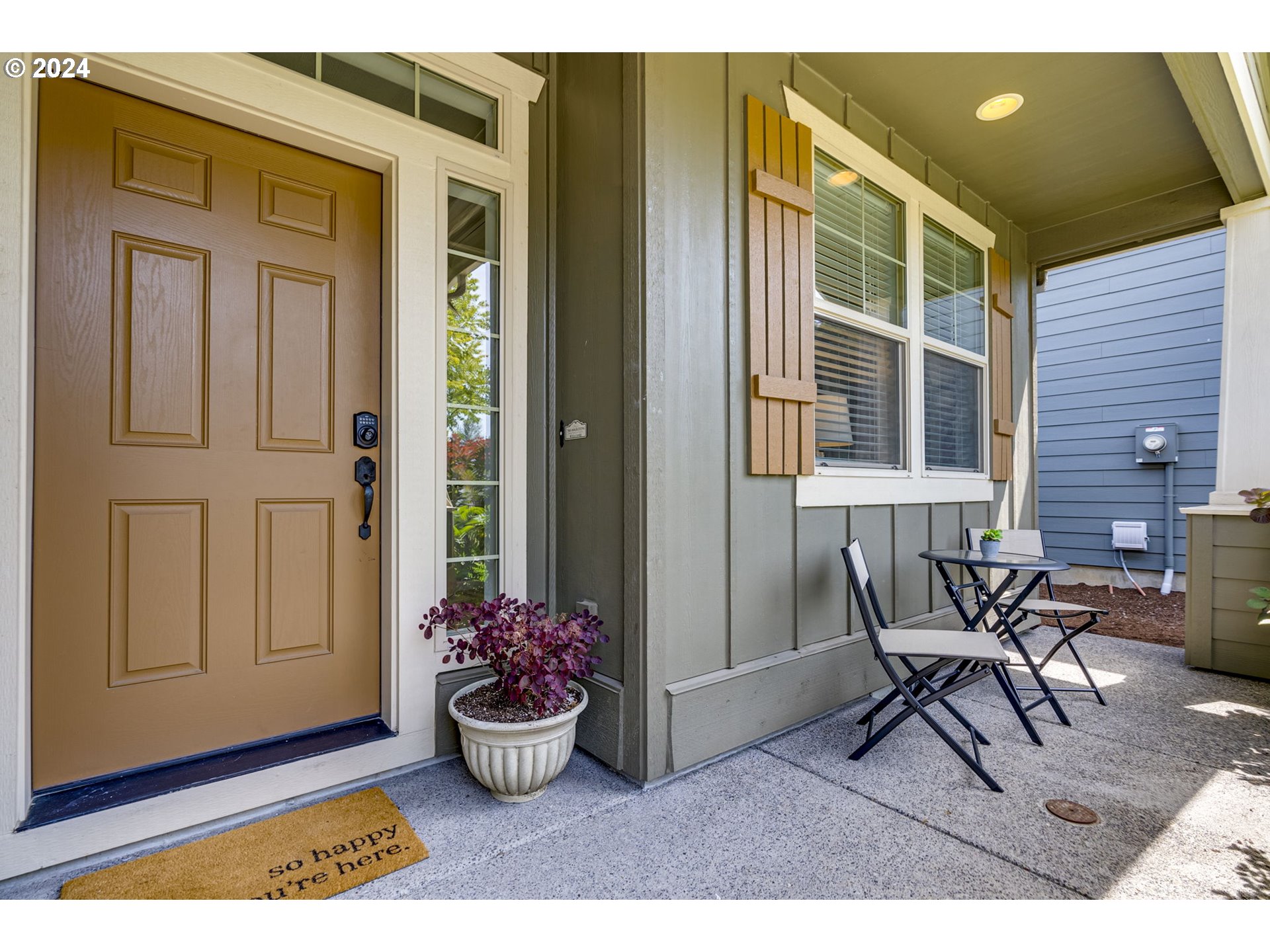 264 North Green Gables Loop Ridgefield, WA 98642 - Photo 5 of 46 a view of a porch with chairs and potted plants